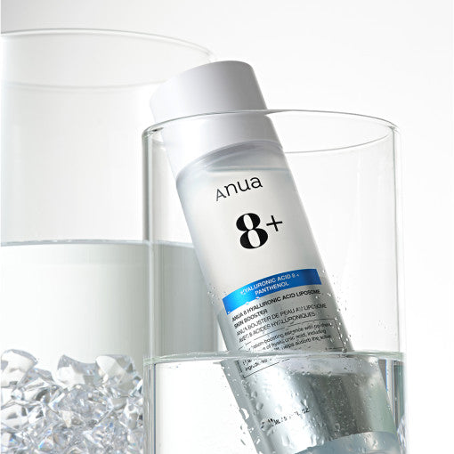 Anua 8 Hyaluronic Acid Liposome Skin Booster bottle with water droplets, showcasing moisturizing Korean skincare essence for sensitive skin.