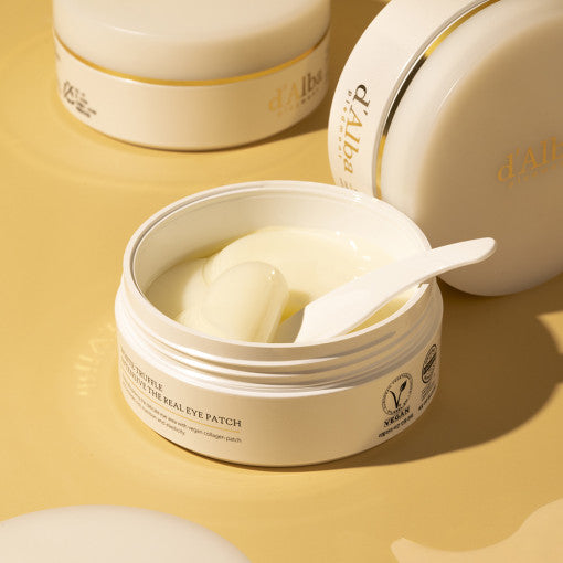 d'Alba White Truffle Eye Patch in gold-accented jar, shown with translucent hydrogel patches for under-eye care