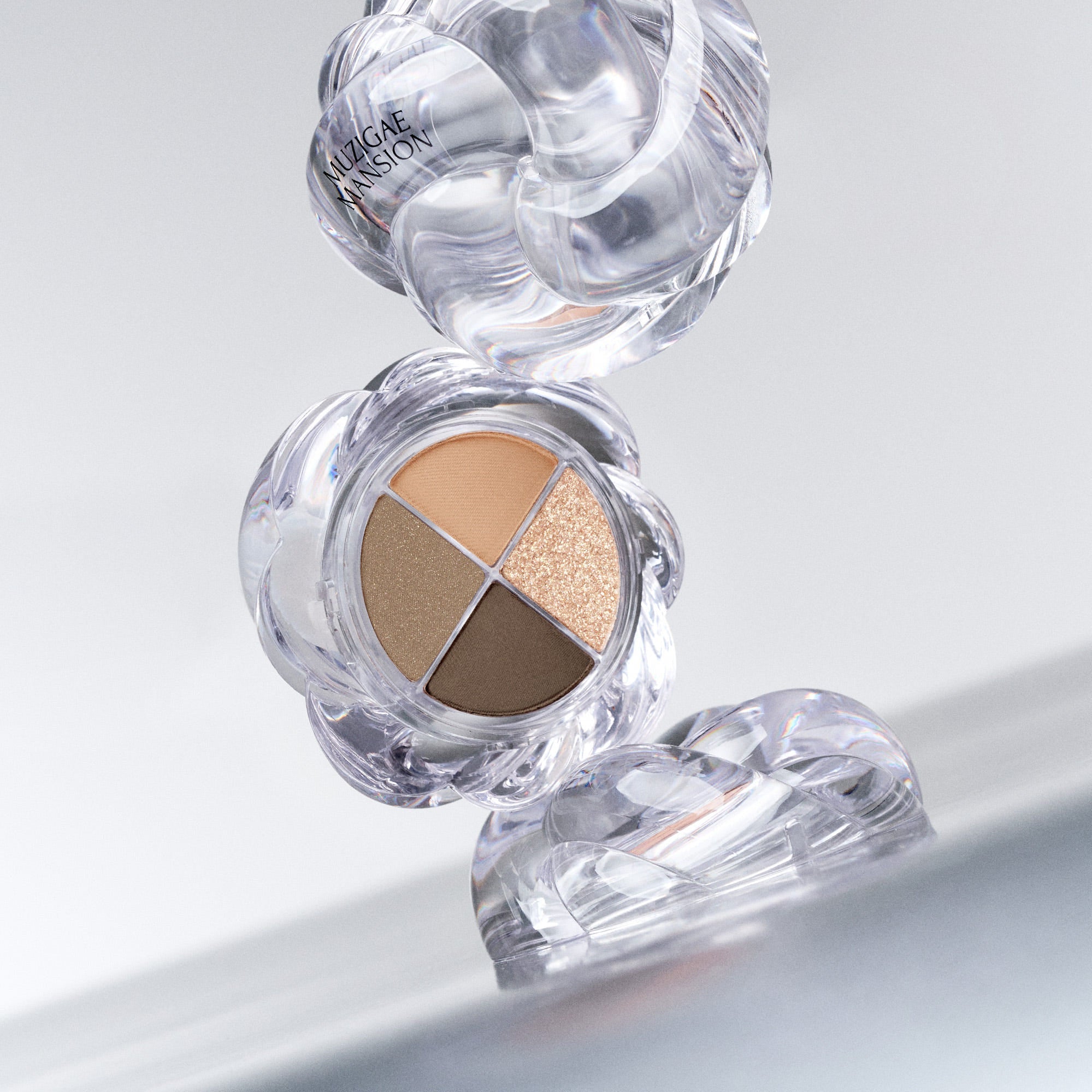 MUZIGAE MANSION twist-open eye palette with 4 neutral shadows in sculptural pot