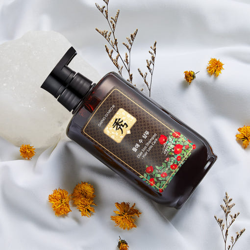 Dark bottle of Daeng Gi Meo Ri hair loss shampoo with herbal-themed design, gel texture for Korean scalp care