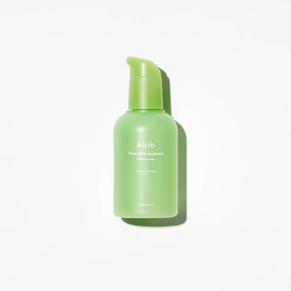 Abib Heartleaf Essence in pump bottle with soft natural lighting