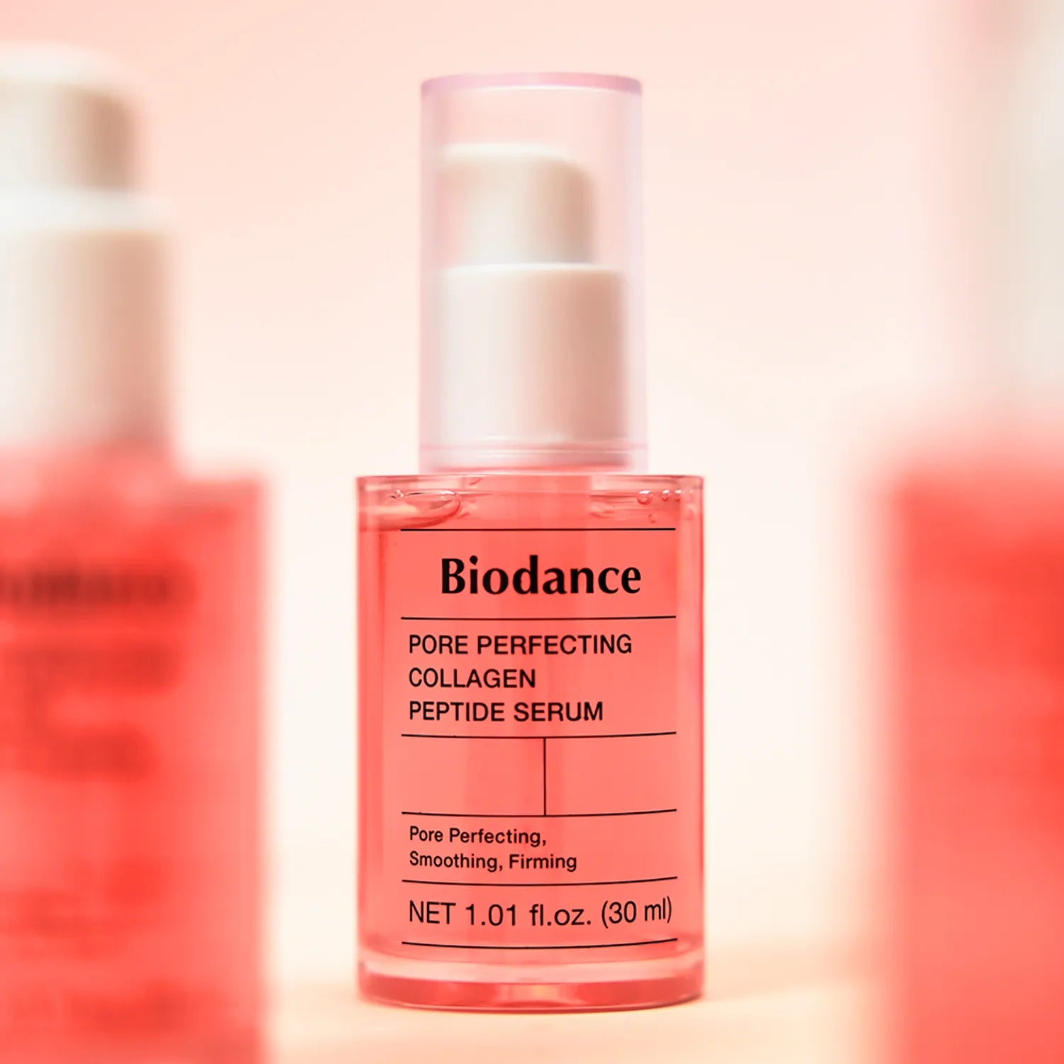 Biodance Pore Perfecting Collagen Peptide Serum bottle on a pink background