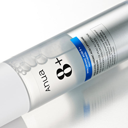 Anua 8 Hyaluronic Acid Liposome Skin Booster bottle with water droplets, showcasing moisturizing Korean skincare essence for sensitive skin.