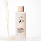Anua Rice 70 Glow Milky Toner bottle with rice grains and milky liquid, showcasing Korean skincare hydration and brightening benefits.