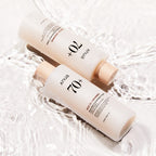 Anua Rice 70 Glow Milky Toner bottle with rice grains and milky liquid, showcasing Korean skincare hydration and brightening benefits.
