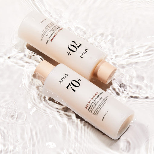 Anua Rice 70 Glow Milky Toner bottle with rice grains and milky liquid, showcasing Korean skincare hydration and brightening benefits.