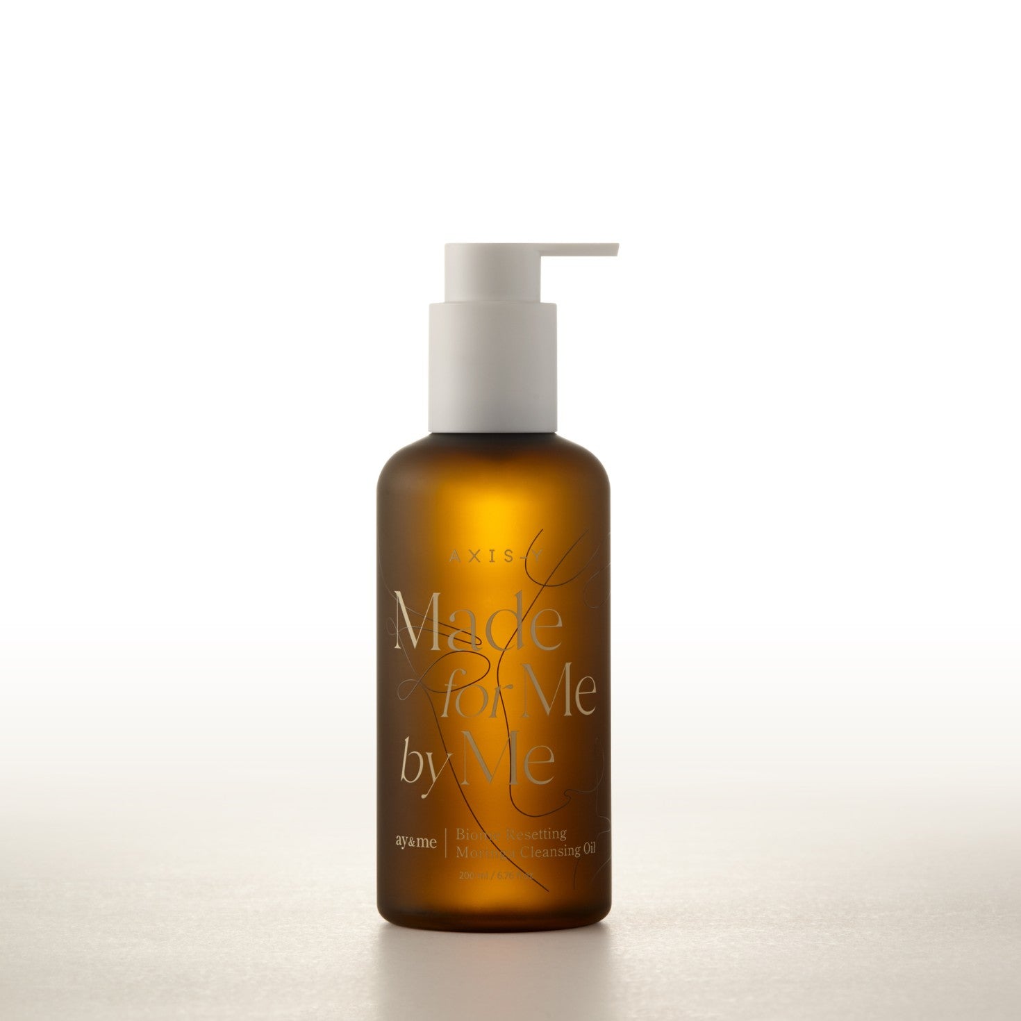 Brown bottle with pump labeled 'Made by Me' on a white background