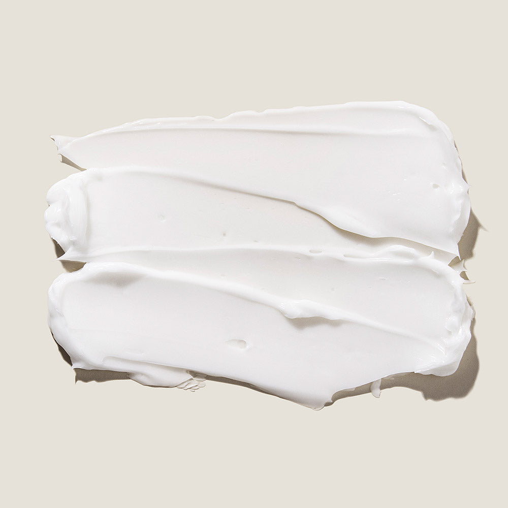 Skincare tube with silver cap on white background