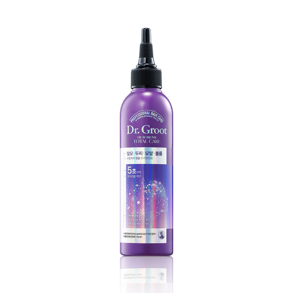 A bottle of Dr.Groot Microbiome Ampoule Treatment designed for hair loss and scalp care, with a purple label and cap.