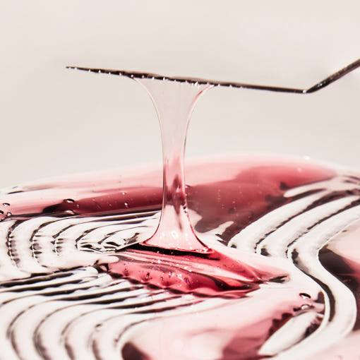 Biodance Pore Perfecting Collagen Peptide Serum bottle on a pink background